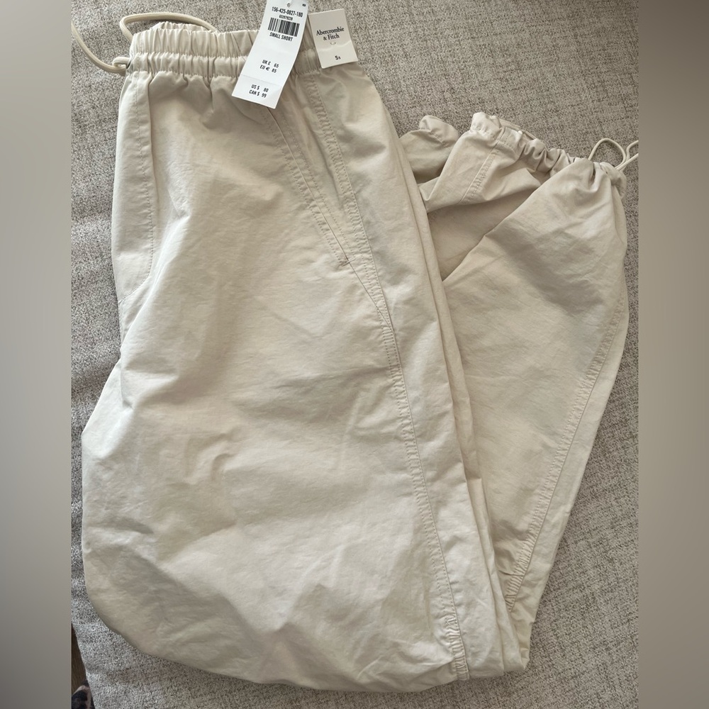 Cream colored parachute pants